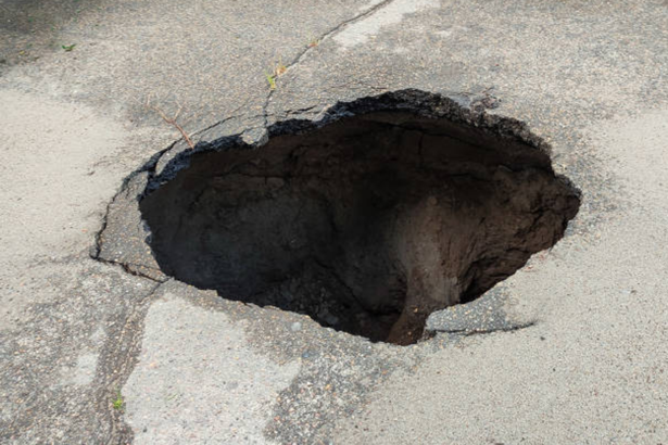 Massive Sinkhole in Japan Swallows Truck and Traps Driver