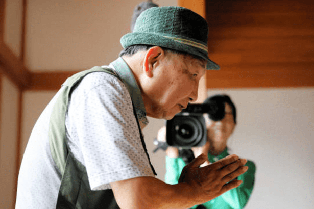 Elderly man bowing respectfully
