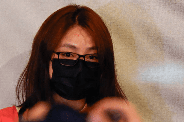 Woman wearing black mask