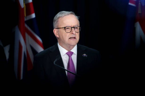 Anthony Albanese speaking at podium