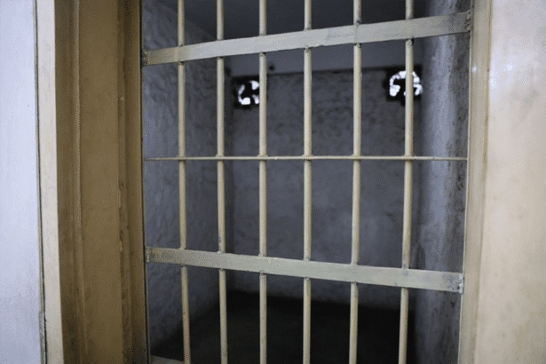 Empty prison cell bars