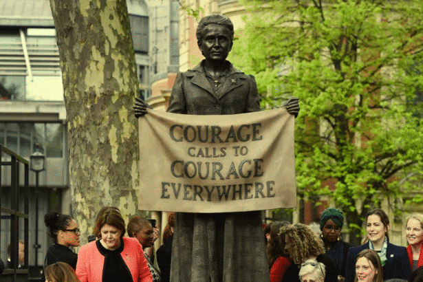 Statue with protest banner