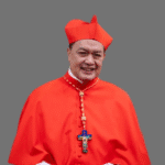 Cardinal aiding poor